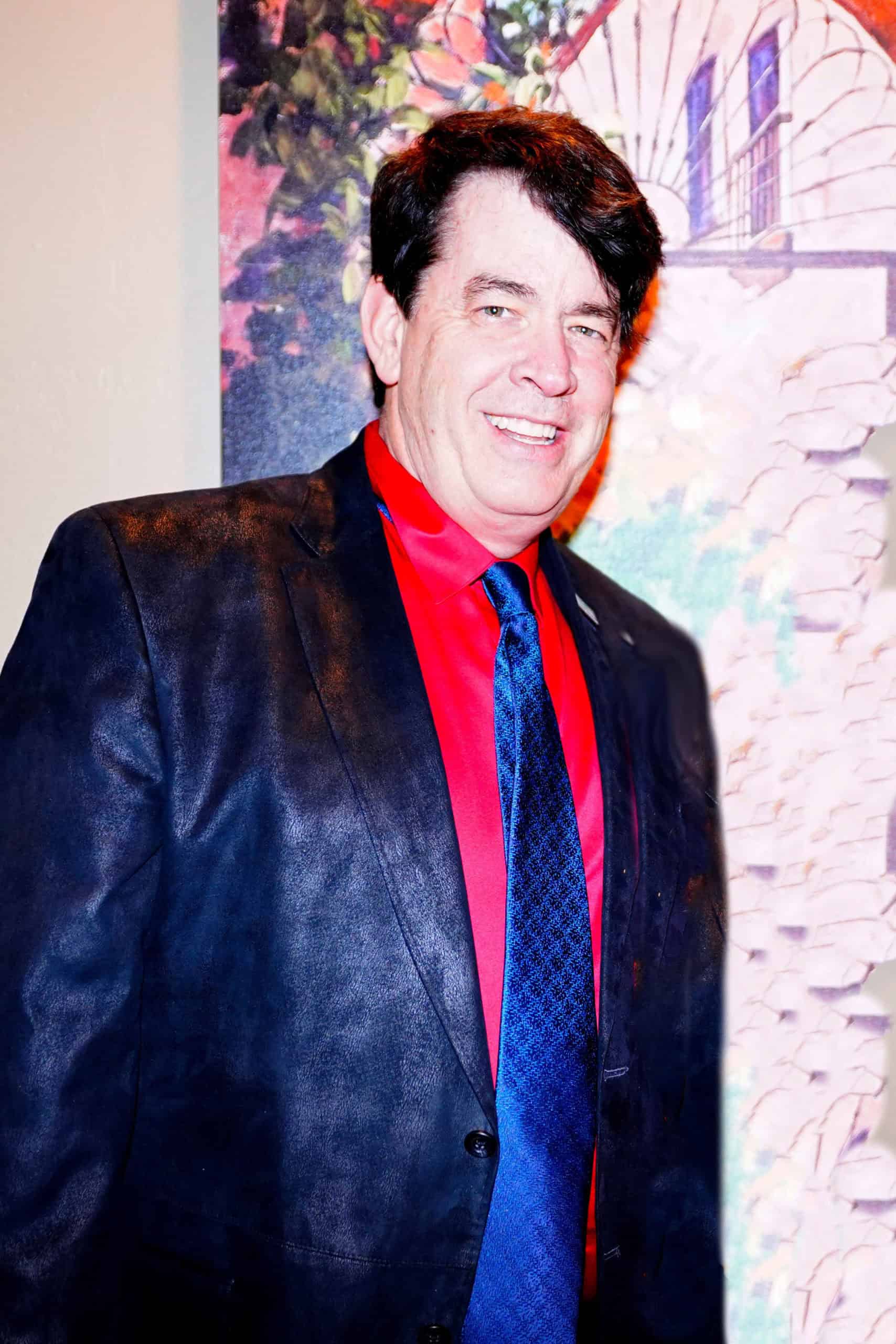 Howard Stewart poses in a suit.