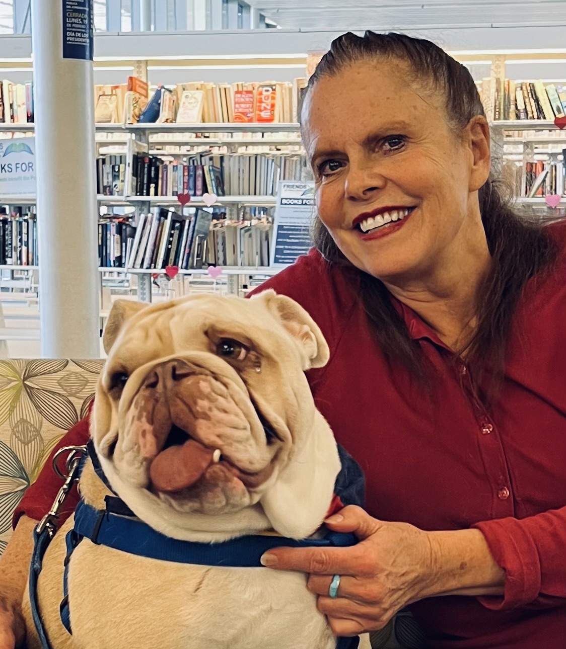 Sharon Foltz Community Service Recognition Sharon smiling while hugging bulldog Winston
