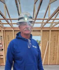 Rick Witt Community Service Recognition smiling on a Habitat construction site