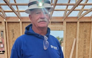 Rick Witt Community Service Recognition smiling on a Habitat construction site