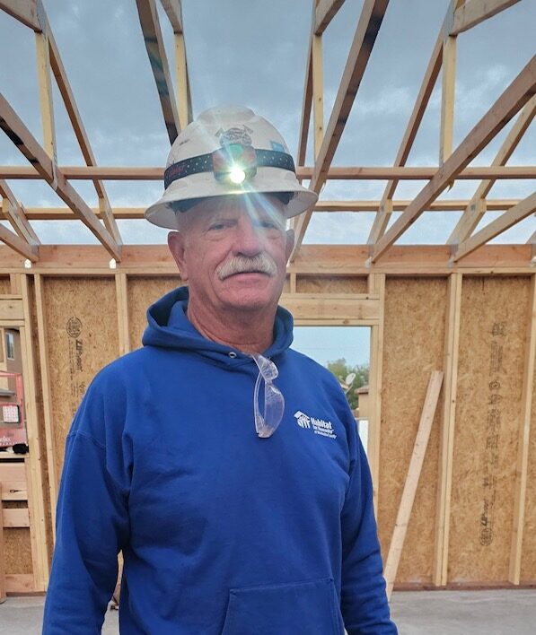 Rick Witt Community Service Recognition smiling on a Habitat construction site