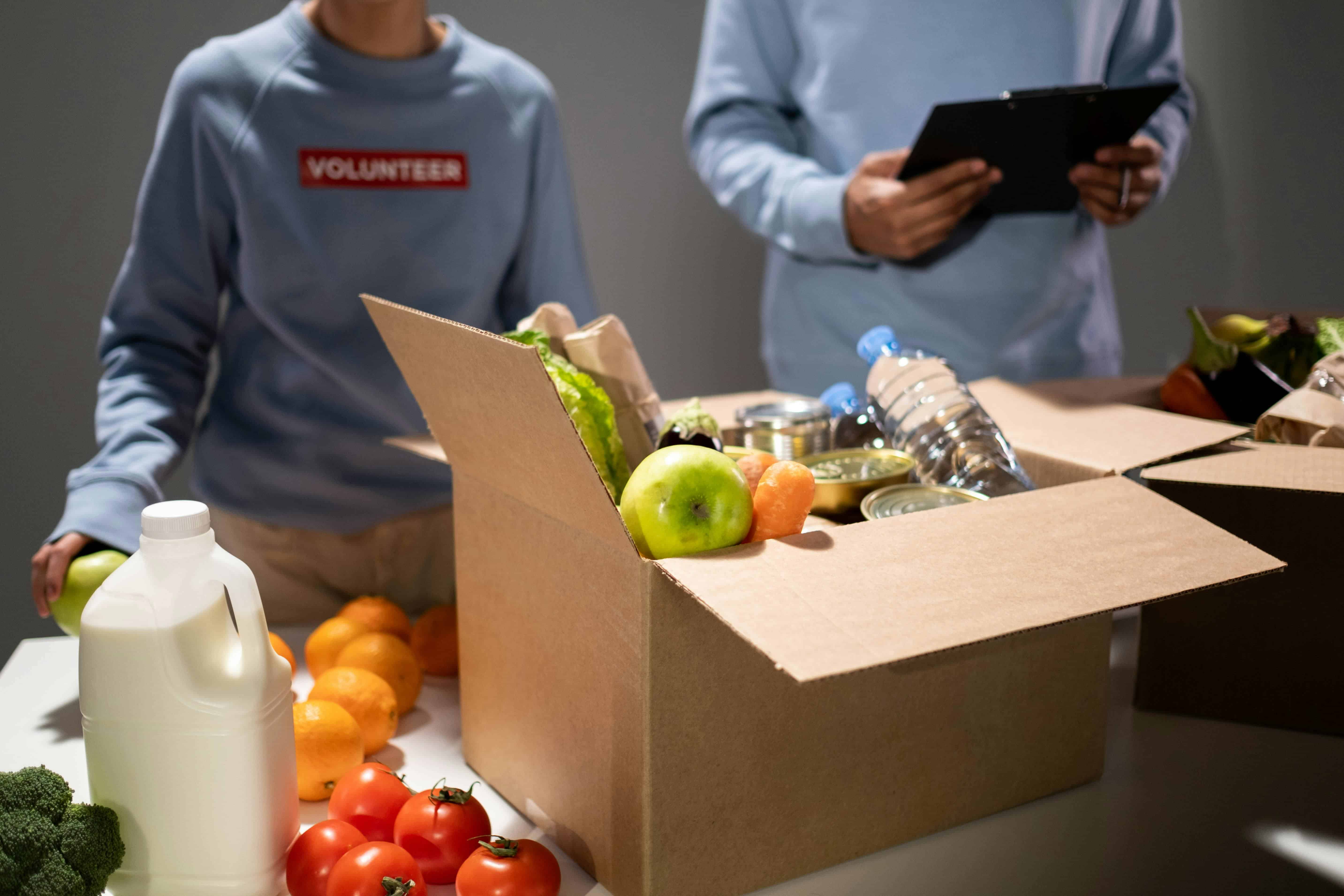 Volunteers sorting and packing food